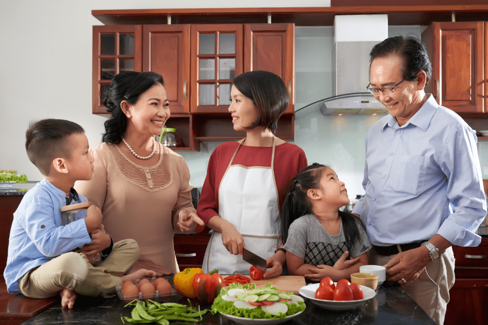 Filipino Family Gathered in the Kitchen