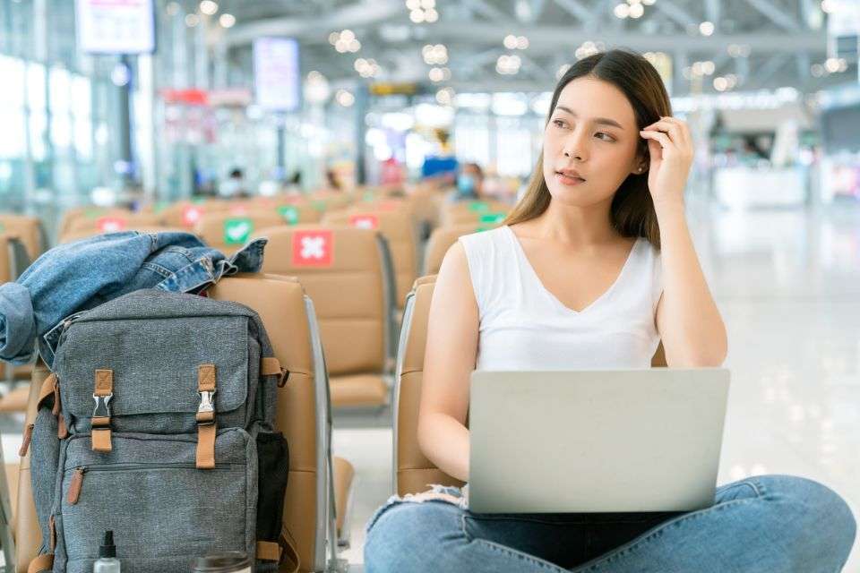 Attractive Asian Woman Waiting in the Airport Terminal - What Makes an Asian Woman Exceptional - Blossoms Dating Blog