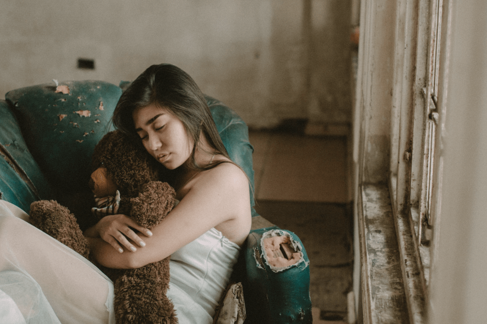 Filipina Hugging a Teddy Bear - Why You Should Date a Filipina - Blossoms Dating Blog