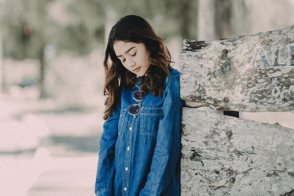 Filipina  in Denim Dress Holding a Sun Hat - How To Tell if A Filipina Is Lying - Blossoms Dating Blog