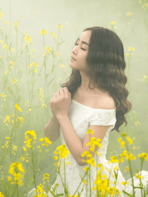 Filipino Woman in a Field of Yellow Flowers