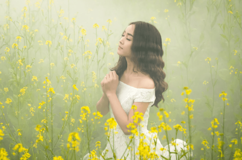 Filipino Woman in a Field of Yellow Flowers