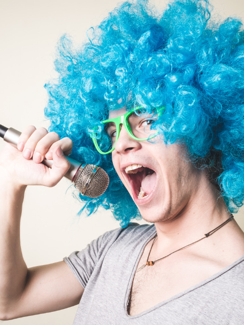 Funny Man Wearing a Blue Wig While Holding a Microphone