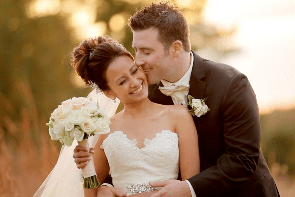 Groom Kissing His Bride - Why Do Filipino Women Marry Foreigners - Blossoms Dating Blog