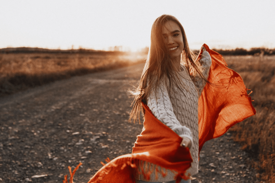 Happy Filipina Woman Holding a Scarf - 