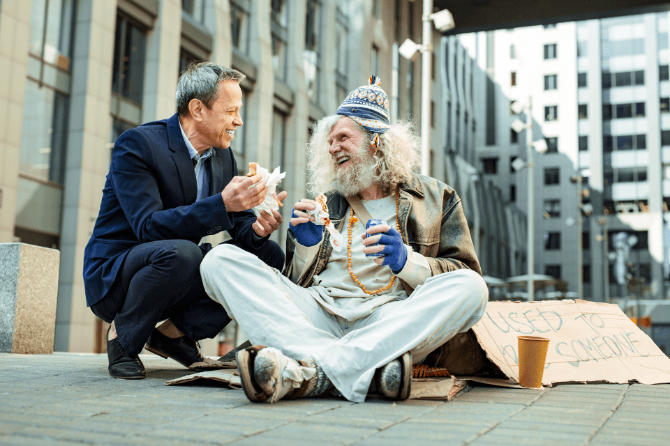 Kind Man Enjoying Communication with a Hippy Man in Tattered Clothes