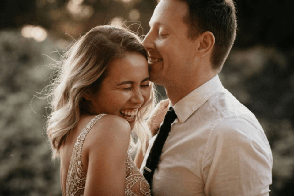 Affectionate Happy Bride and Groom Outdoors