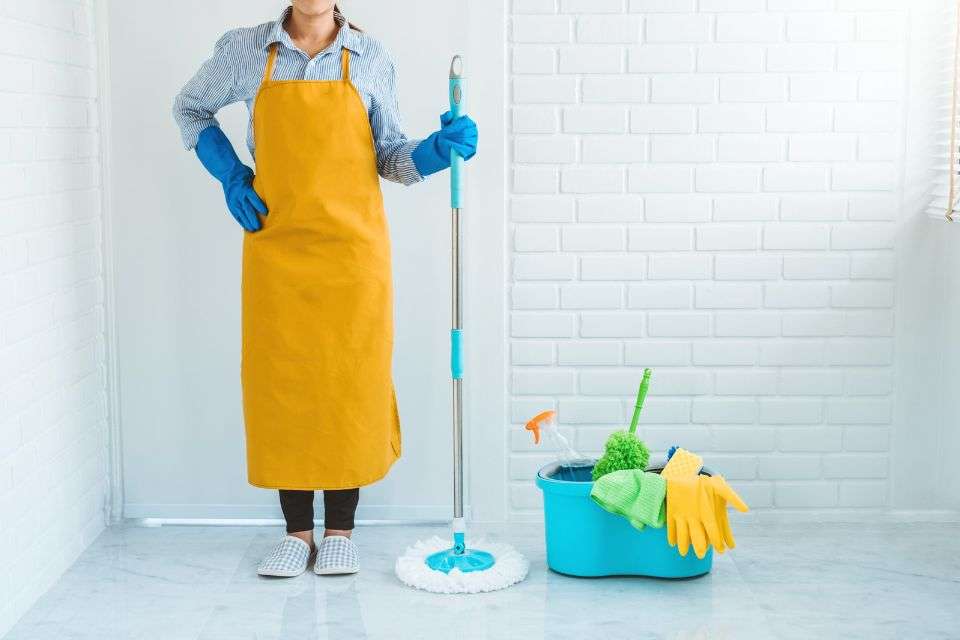 Filipino Woman with Cleaning Equipment - The Pros and Cons of Dating a Filipino Woman - Blossoms Dating Blog