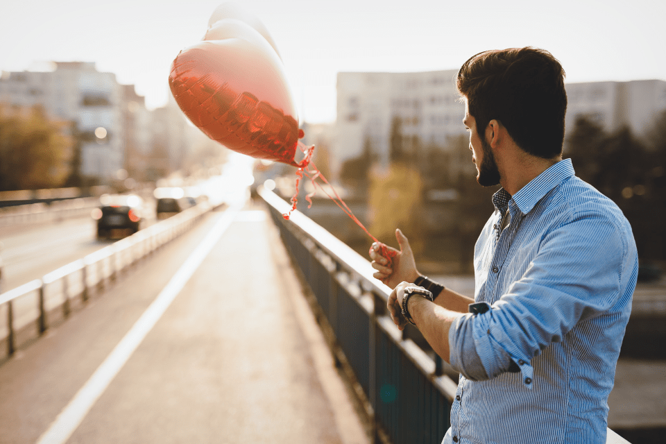 Man with Heart-shaped Balloon Waiting for His Filipina Date - 5 Secrets to Impress a Filipina on Your First Date - Blossoms Dating Blog