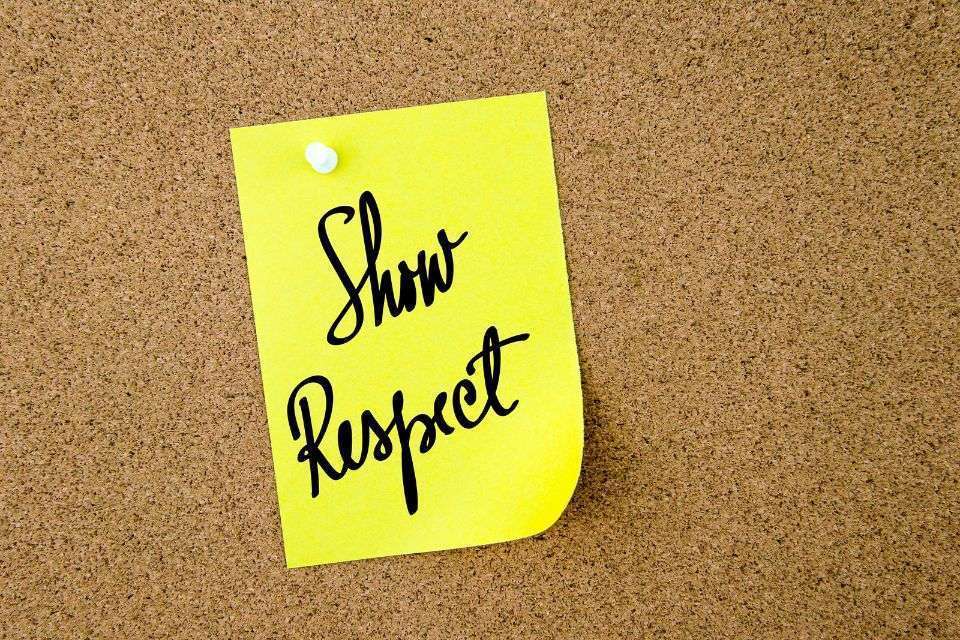 Show Respect Written on Yellow Paper Pinned on a Cork Board