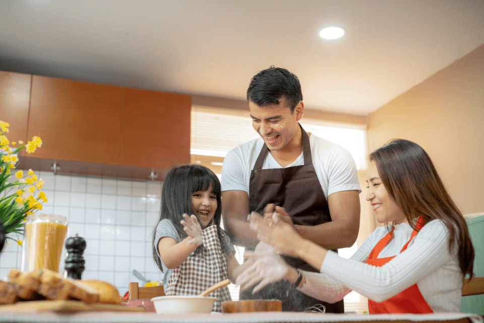 Sweet Family Weekend Activity Cooking with Mom and Dad - The Top Traits Filipino Women Look for in a Partner - Blossoms Dating Blog