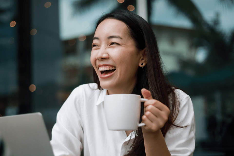 Filipina Businesswoman Working in a Cafe