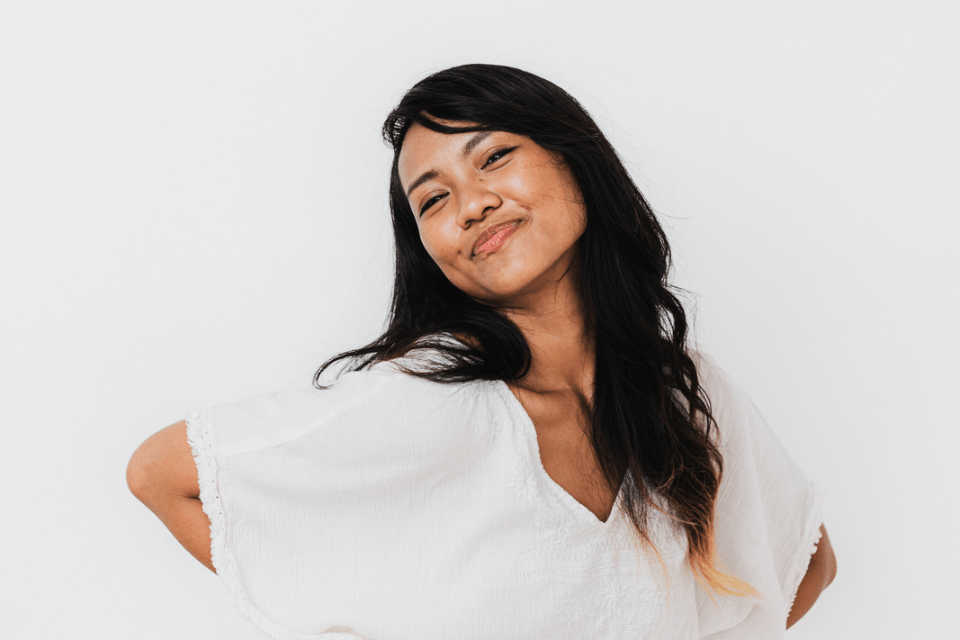 Filipina Wearing White Hamming It Up for the Camera