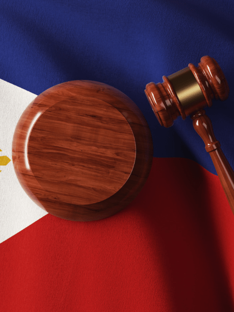 Wooden Gavel on Philippine Flag - Simple Guide to Philippine Dating Laws - Blossoms Dating Blog