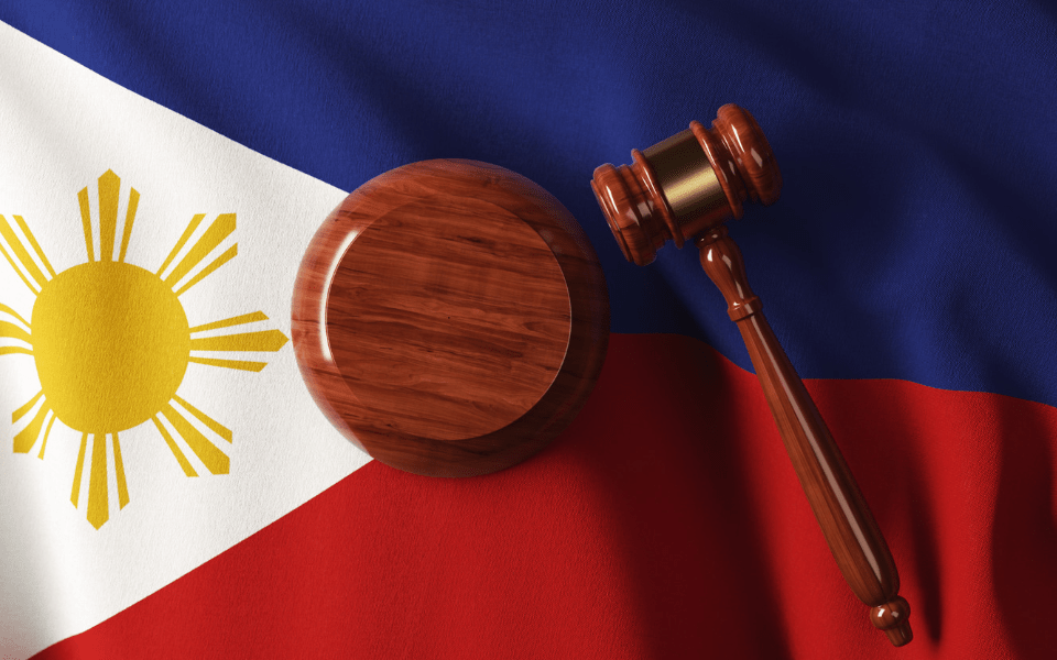 Wooden Gavel on Philippine Flag - Simple Guide to Philippine Dating Laws - Blossoms Dating Blog