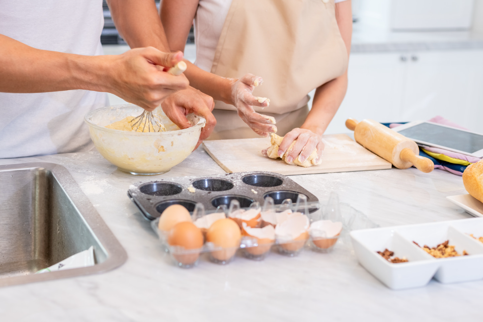 Happy Interracial Couple Cooking and Baking Together