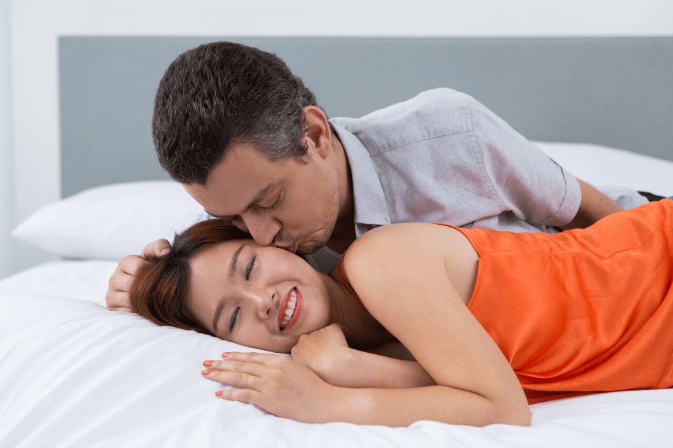 Mature Husband Kissing His Young Filipina Wife