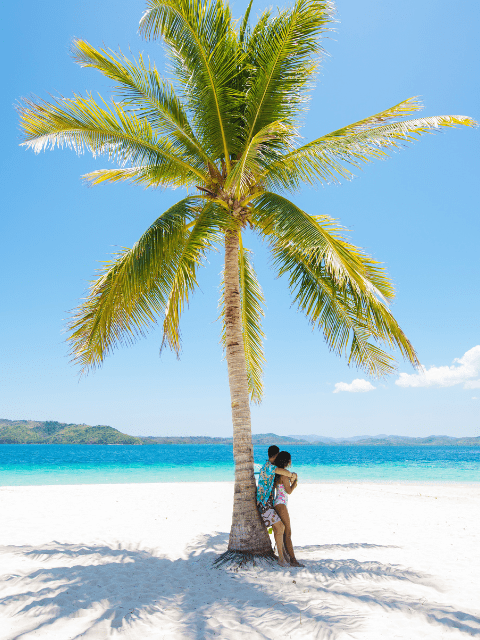 A couple on a romantic beach in Coron, Palawan, Philippines