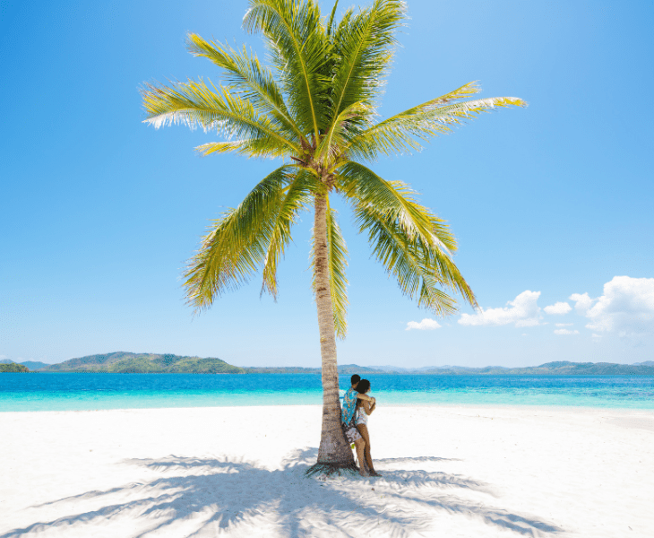 A couple on a romantic beach in Coron, Palawan, Philippines