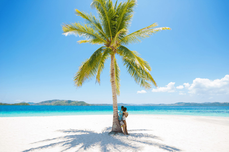 A couple on a romantic beach in Coron, Palawan, Philippines