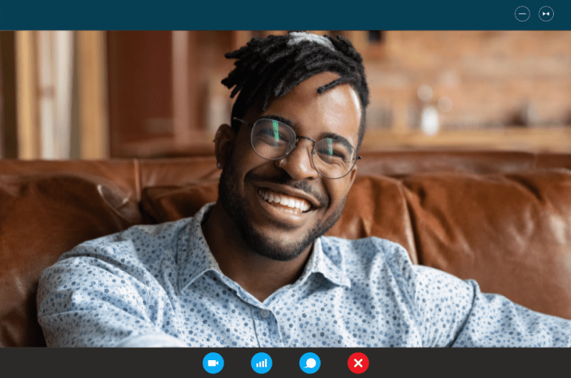 Smiling handsome African American man on a video call.