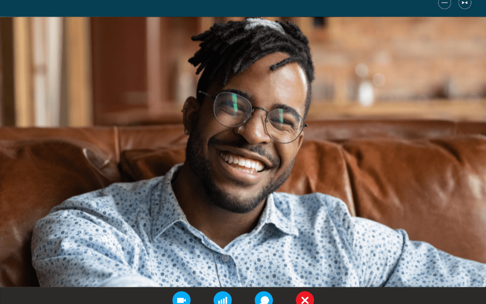 Smiling handsome African American man on a video call.