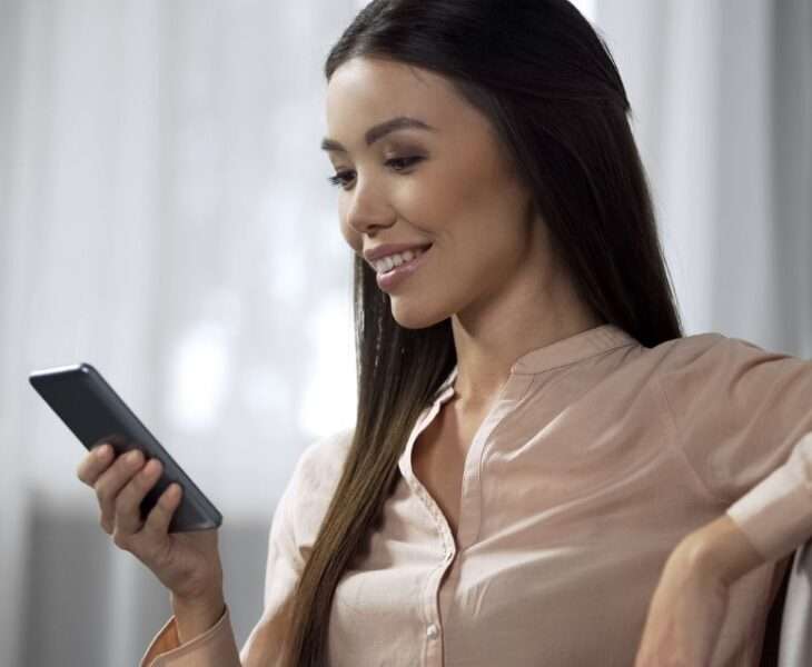 Beautiful Asian Woman Using a Dating App