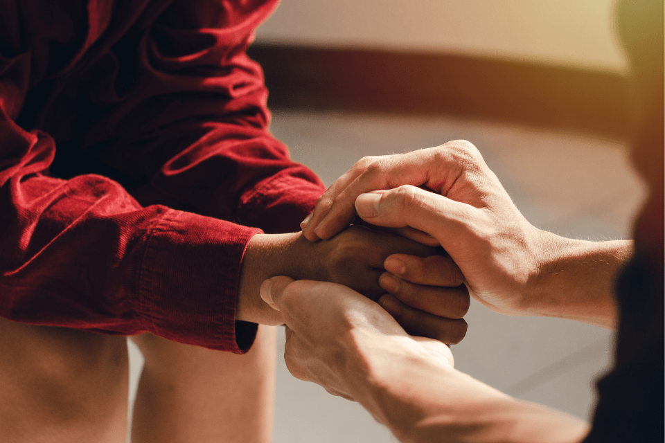 Christian Couple Holding Hands While Praying Together.