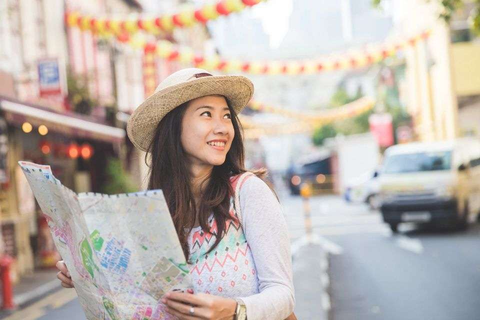 Filipina Tourist Holding a Map