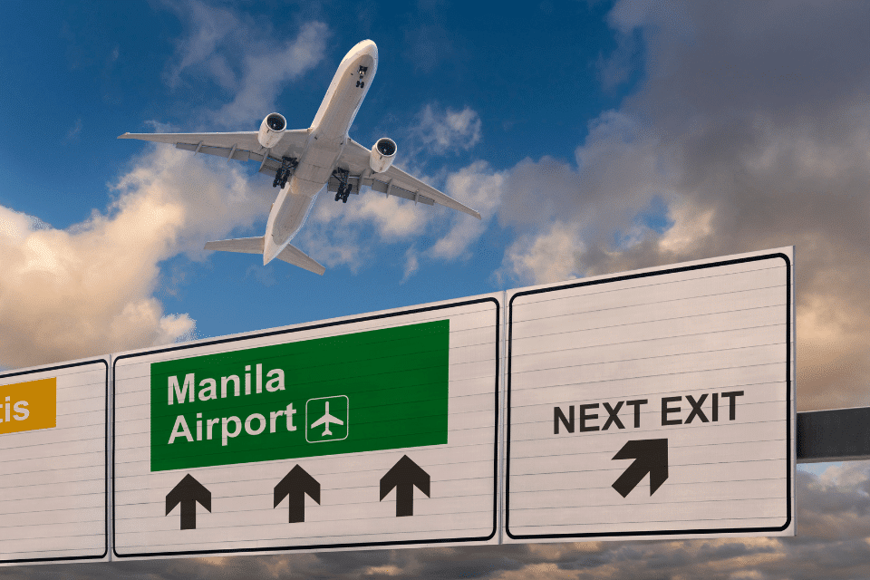 Road sign indicating the direction of Manila airport.